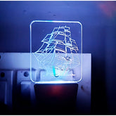 MultiColor sail boat AC adapter night lamp with 3D illusion and laser engraved design on acrylic glass. Ideal for living room, bedroom decor, and gift giving. Safety material and low energy consumption